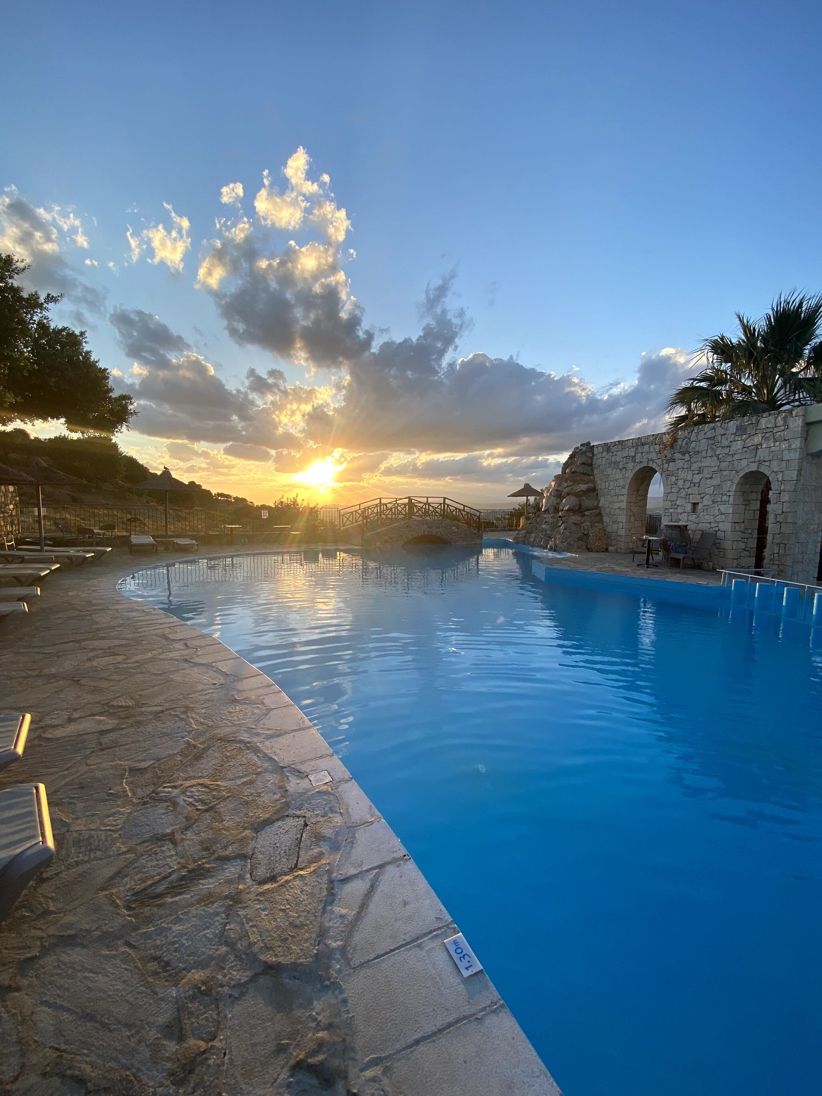 outdoor pool, pool umbrellas, pool loungers