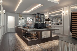 A modern kitchen with a central island, built-in appliances, and a decorative glass cabinet. - Red Tower (Lefkada)