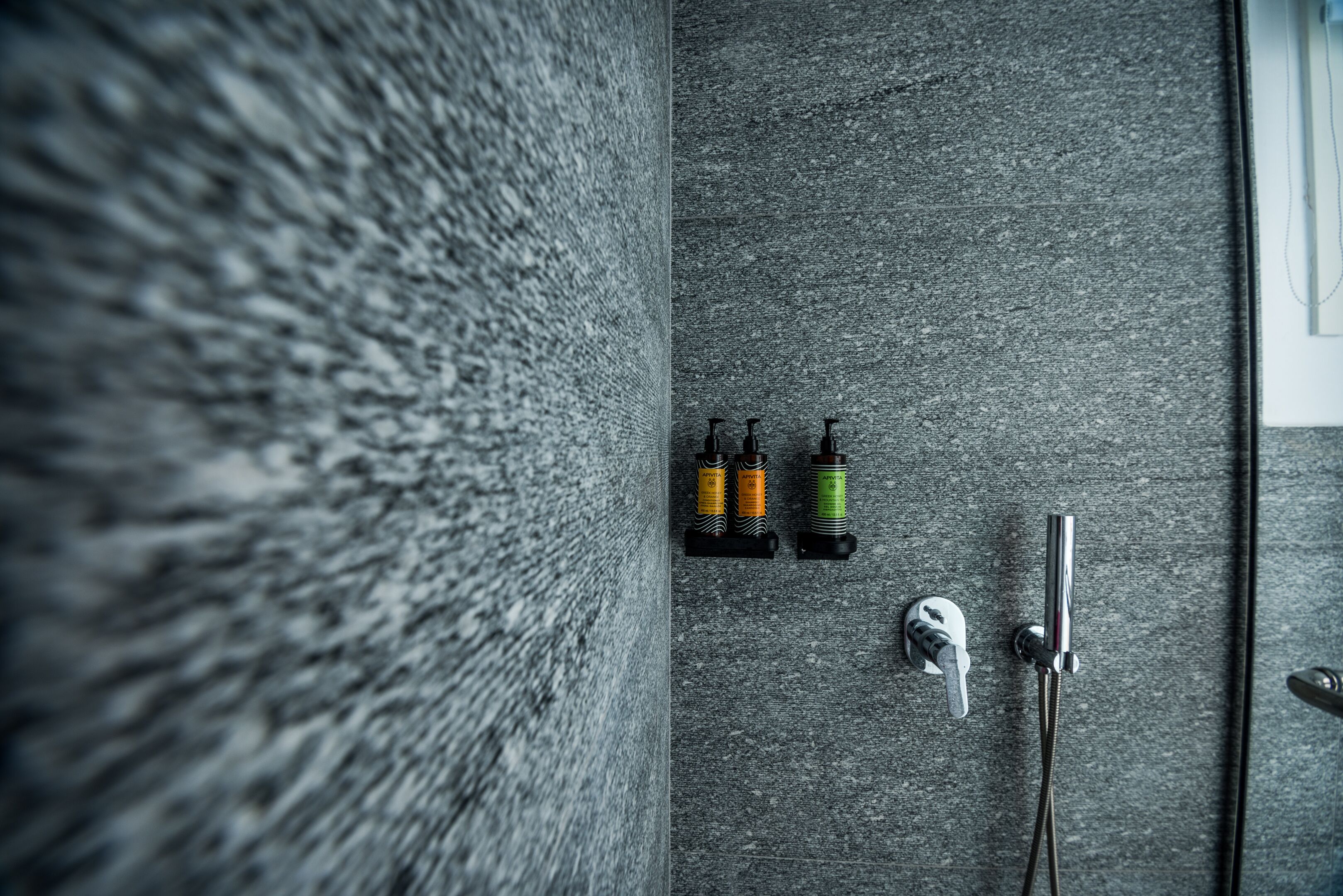 deluxe room | bathroom | shower, free toiletries, hair dryer, bathrobes