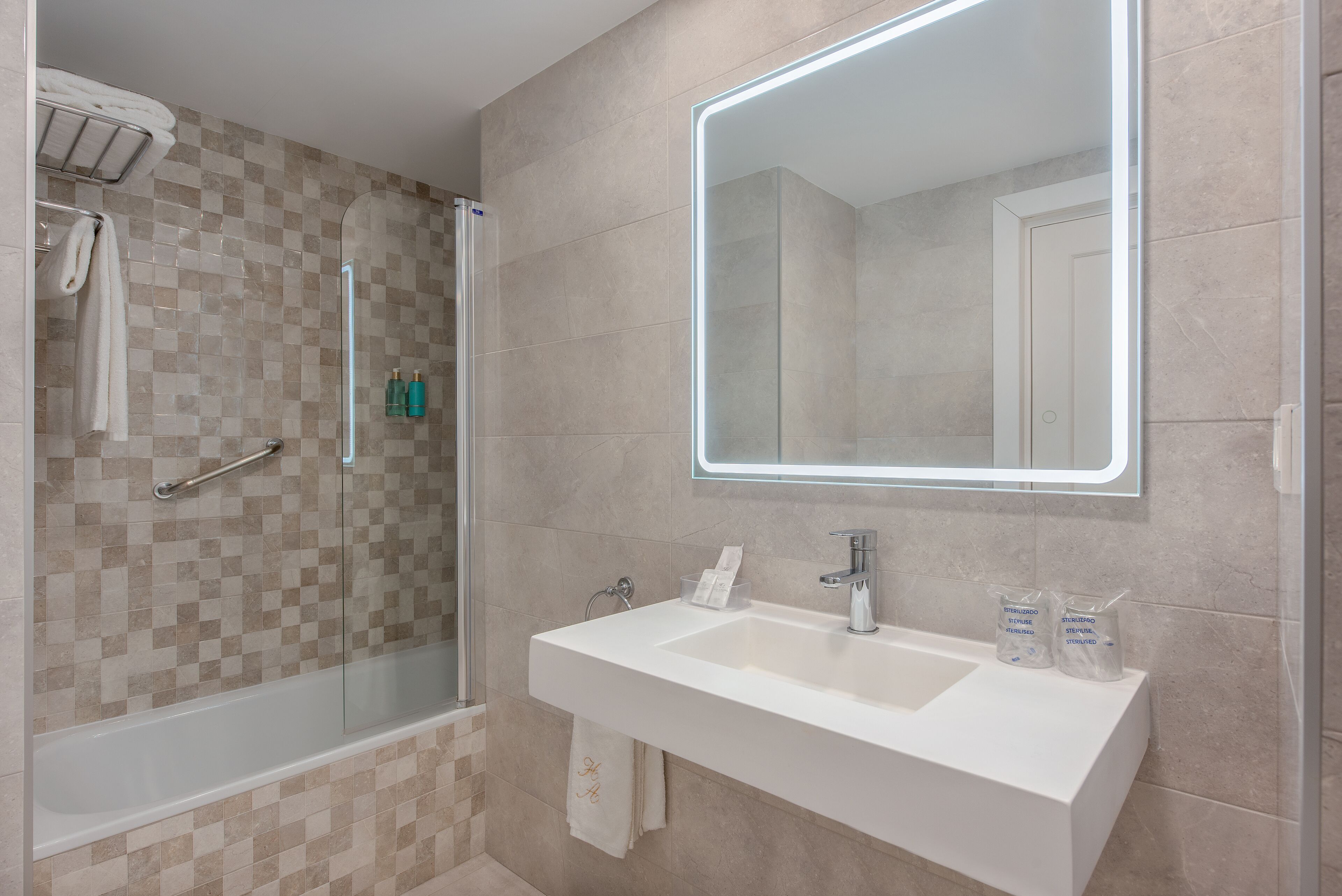 deep-soaking bathtub, rainfall showerhead, free toiletries, hair dryer