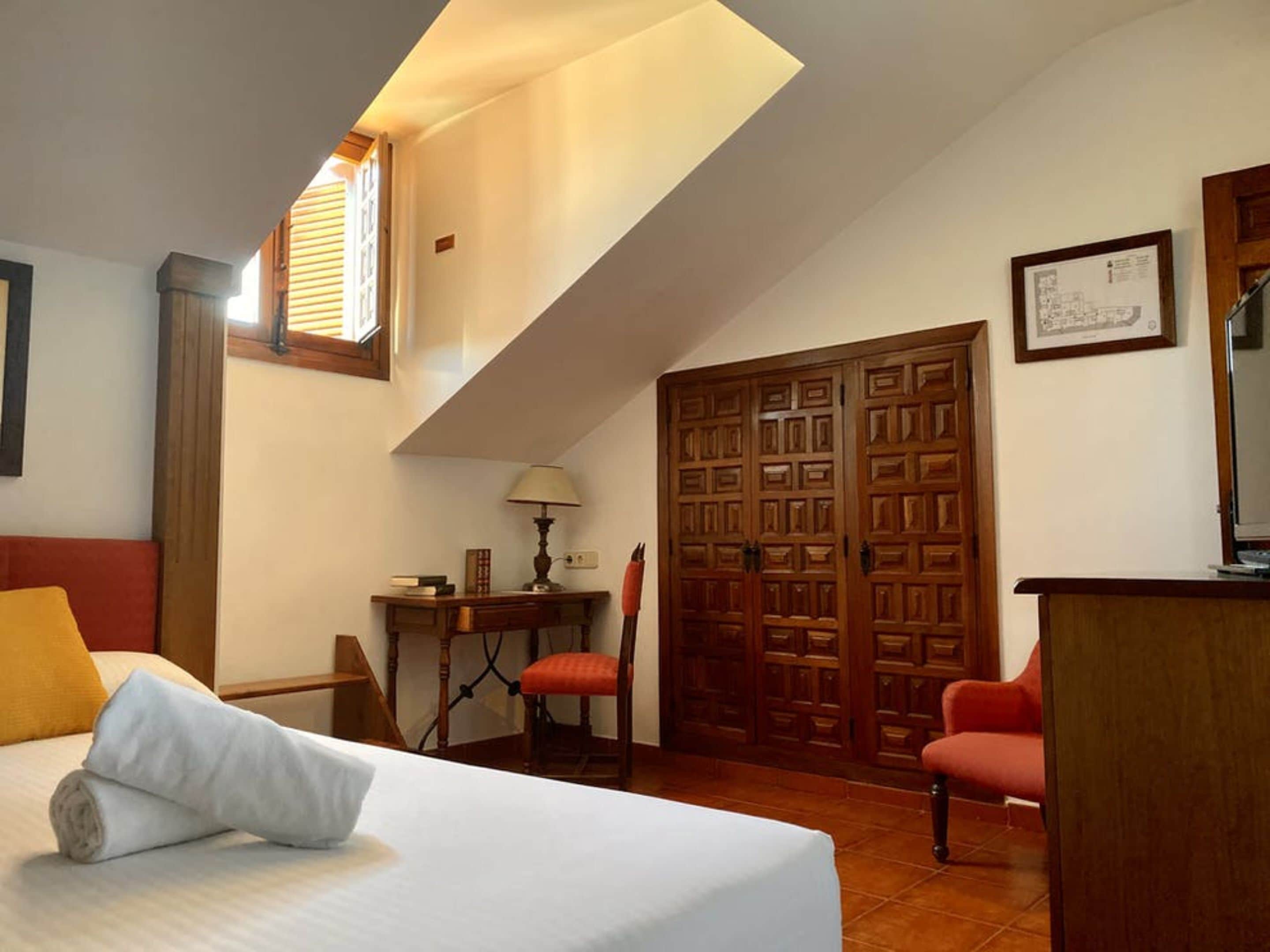 economy room | in-room safe, desk, iron/ironing board, cots/infant beds