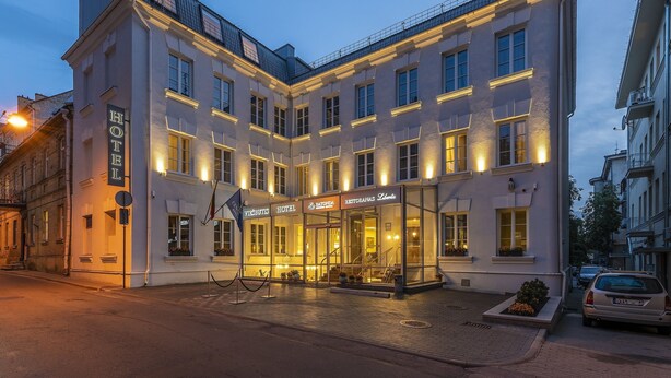 A hotel with a modern facade, large windows, and a well-lit entrance. - Ratonda Centrum Hotels (Vilnius)