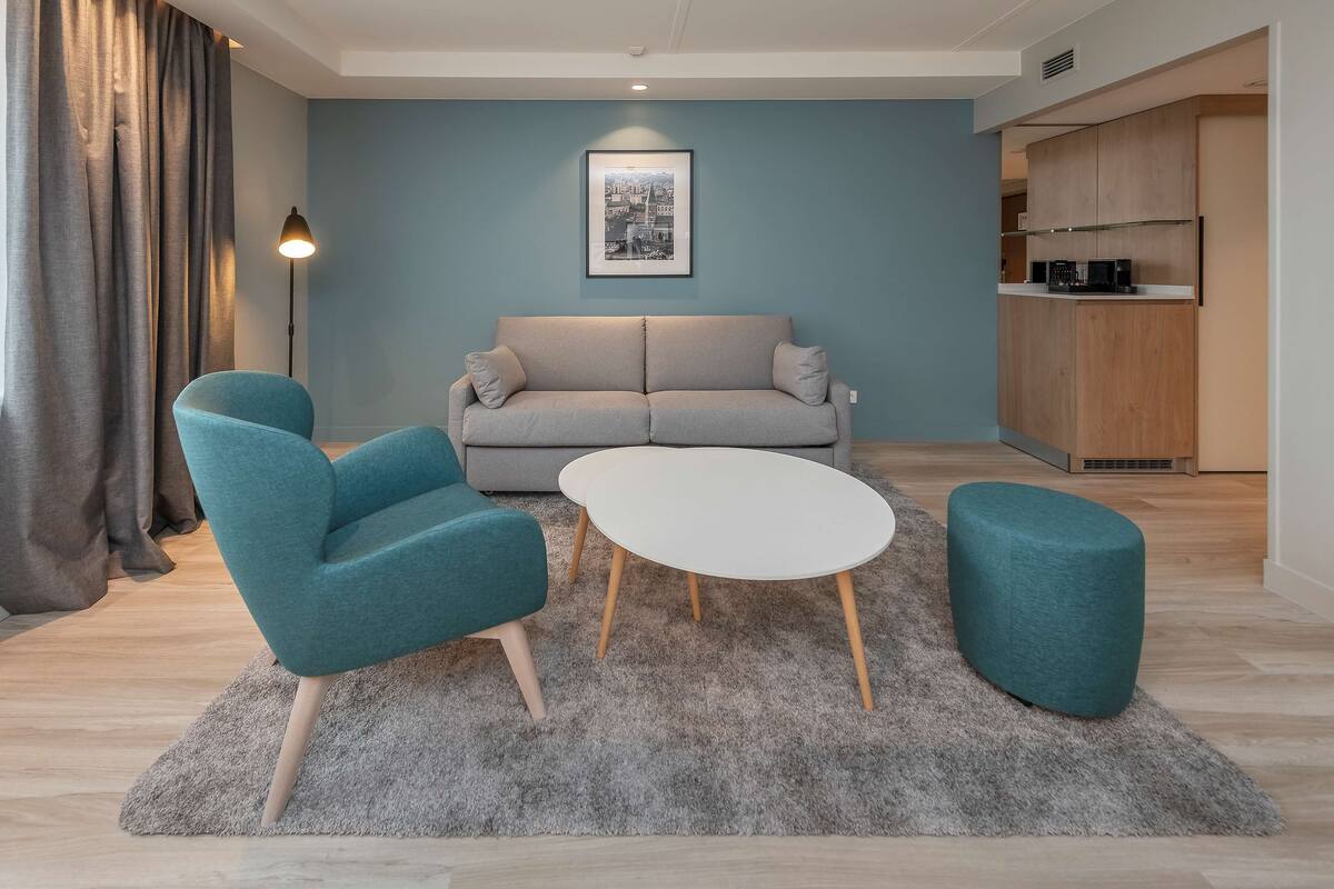 junior suite | 1 bedroom, in-room safe, desk, laptop workspace