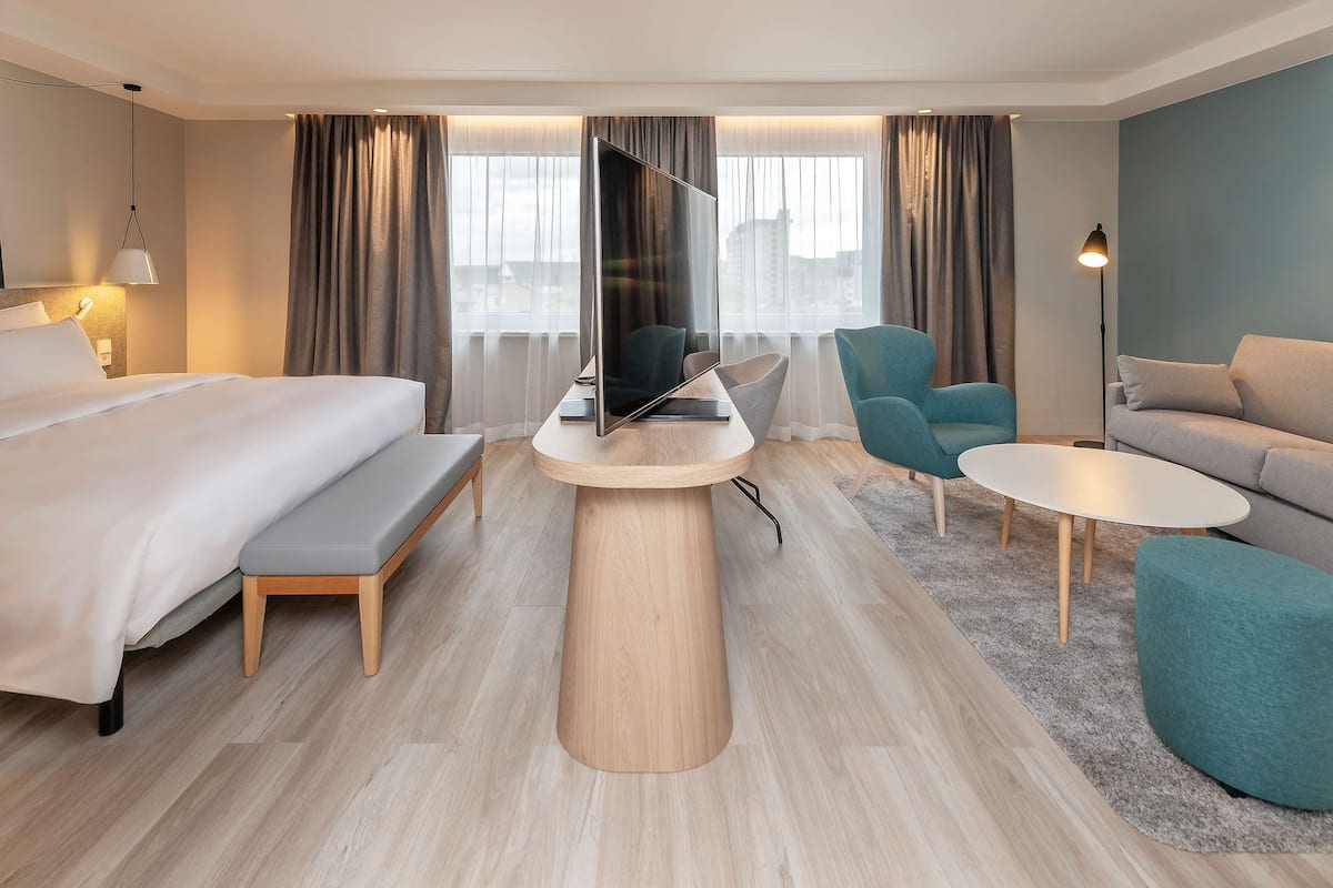 junior suite | 1 bedroom, in-room safe, desk, laptop workspace