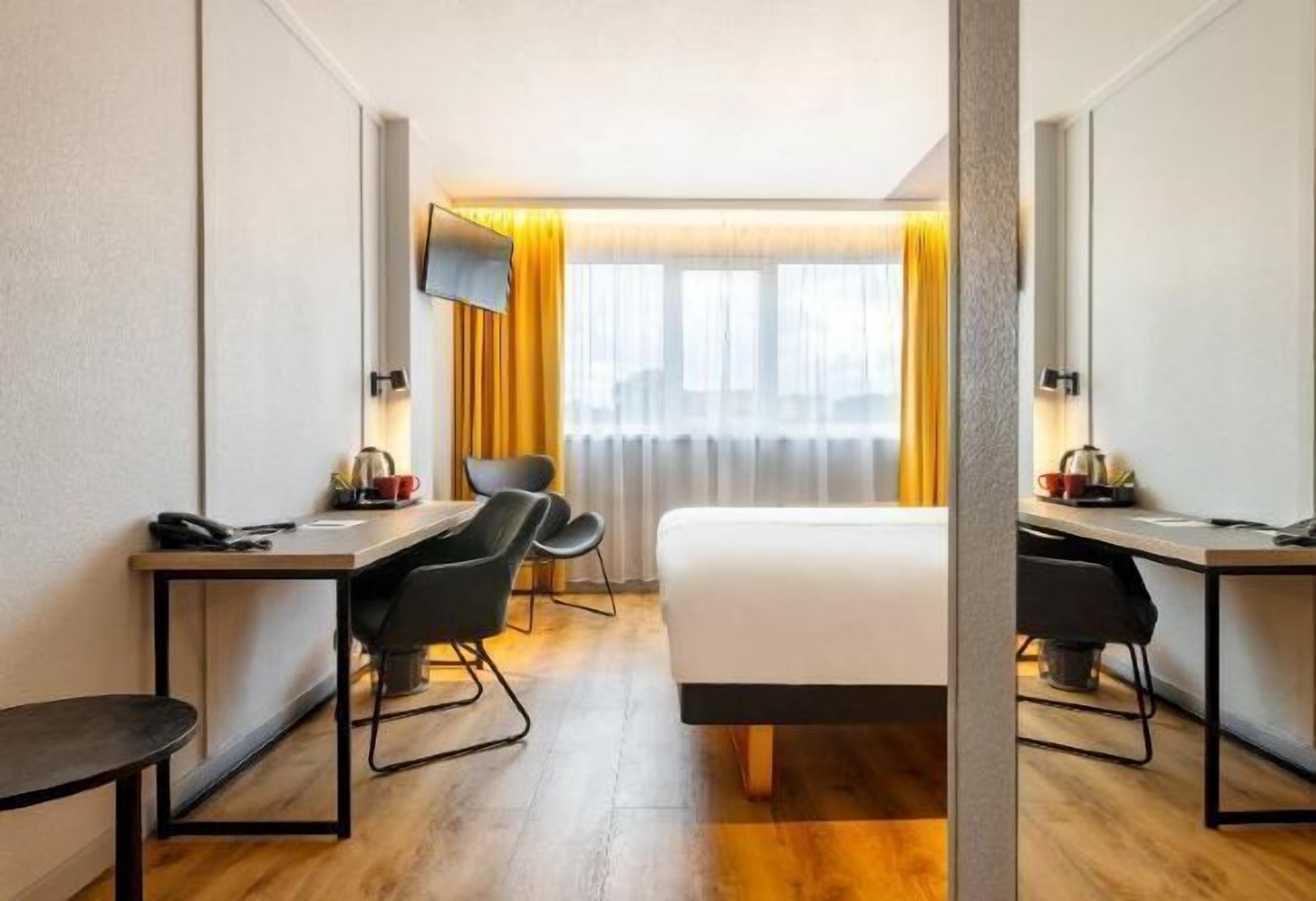 Desk, laptop workspace, blackout drapes, free cribs/infant beds