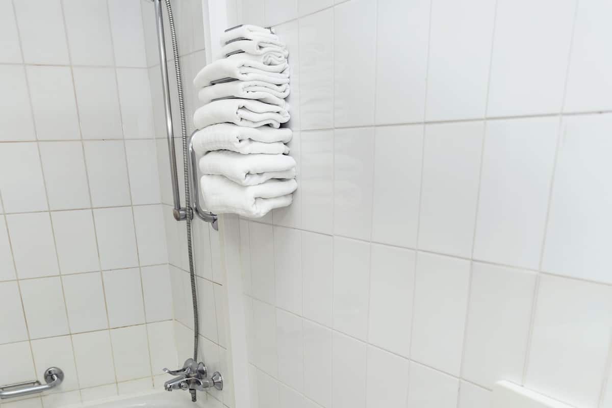 rainfall showerhead, hair dryer, towels, soap