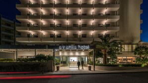 A modern hotel building with a sign reading "amarilia hotel". - Amarilia Hotel (Vari-Voula-Vouliagmeni)