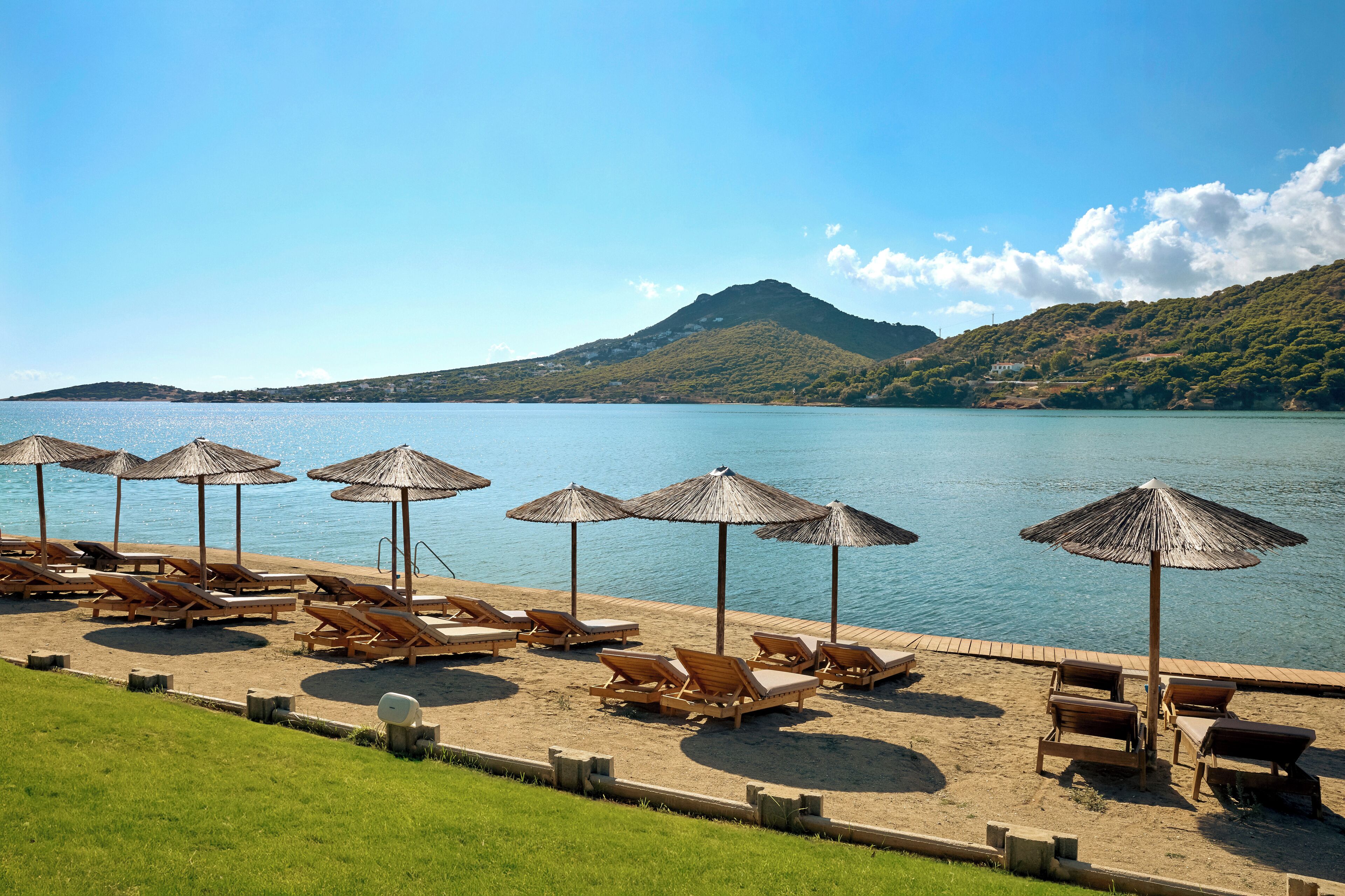 On the beach, sun-loungers, beach umbrellas, beach towels