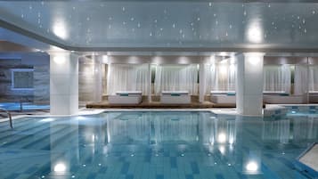 Relax by the pool surrounded by a serene ambiance and stylish lounge seating.