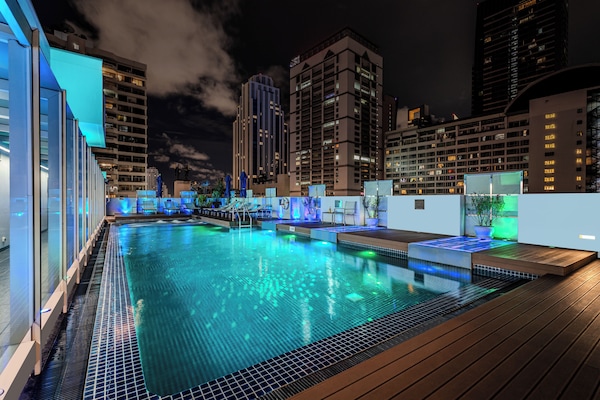 Outdoor pool, open 6:00 AM to 10:00 PM, pool umbrellas, pool loungers