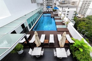Outdoor pool, open 6:00 AM to 10:00 PM, pool umbrellas, sun loungers