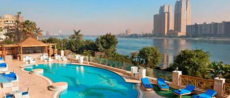 Outdoor pool, pool umbrellas, sun loungers