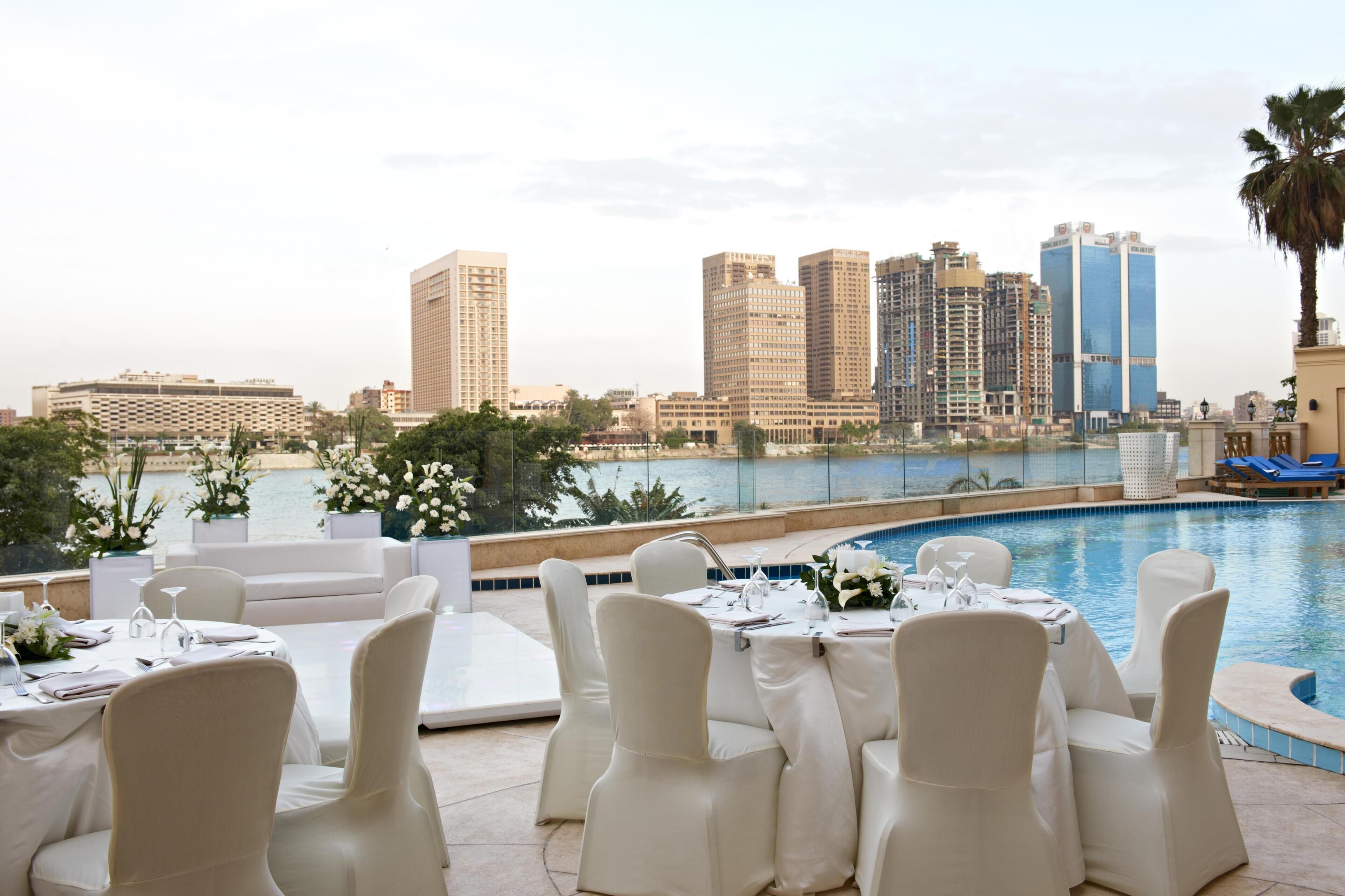 Outdoor pool, pool umbrellas, sun loungers