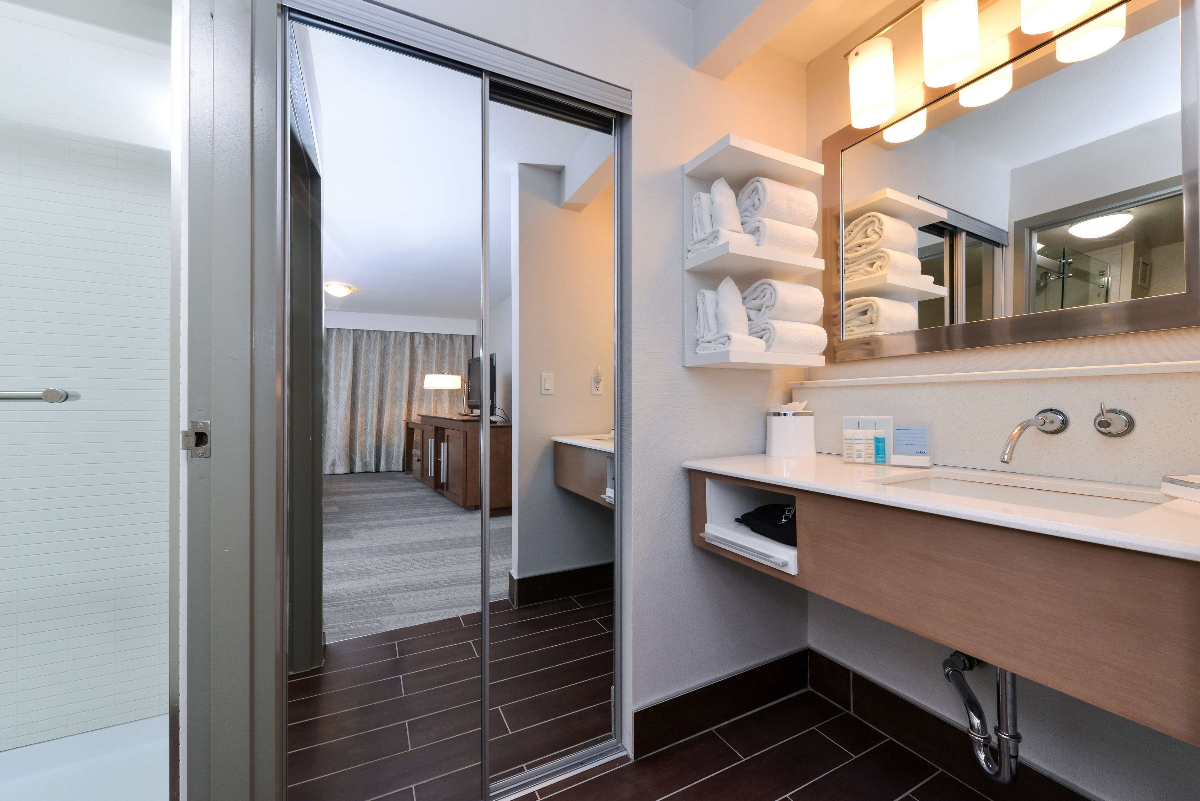 exclusive room, 1 king bed, kitchen (living area) | bathroom | free toiletries, hair dryer, towels, soap