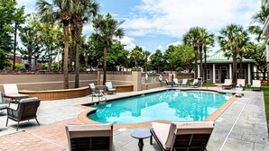 A swimming pool with lounge chairs and palm trees. - Hampton Inn & Suites Charleston/West Ashley (Charleston)