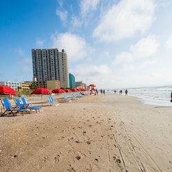 On the beach, white sand, beach towels