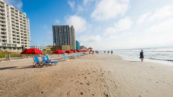 On the beach, white sand, beach towels