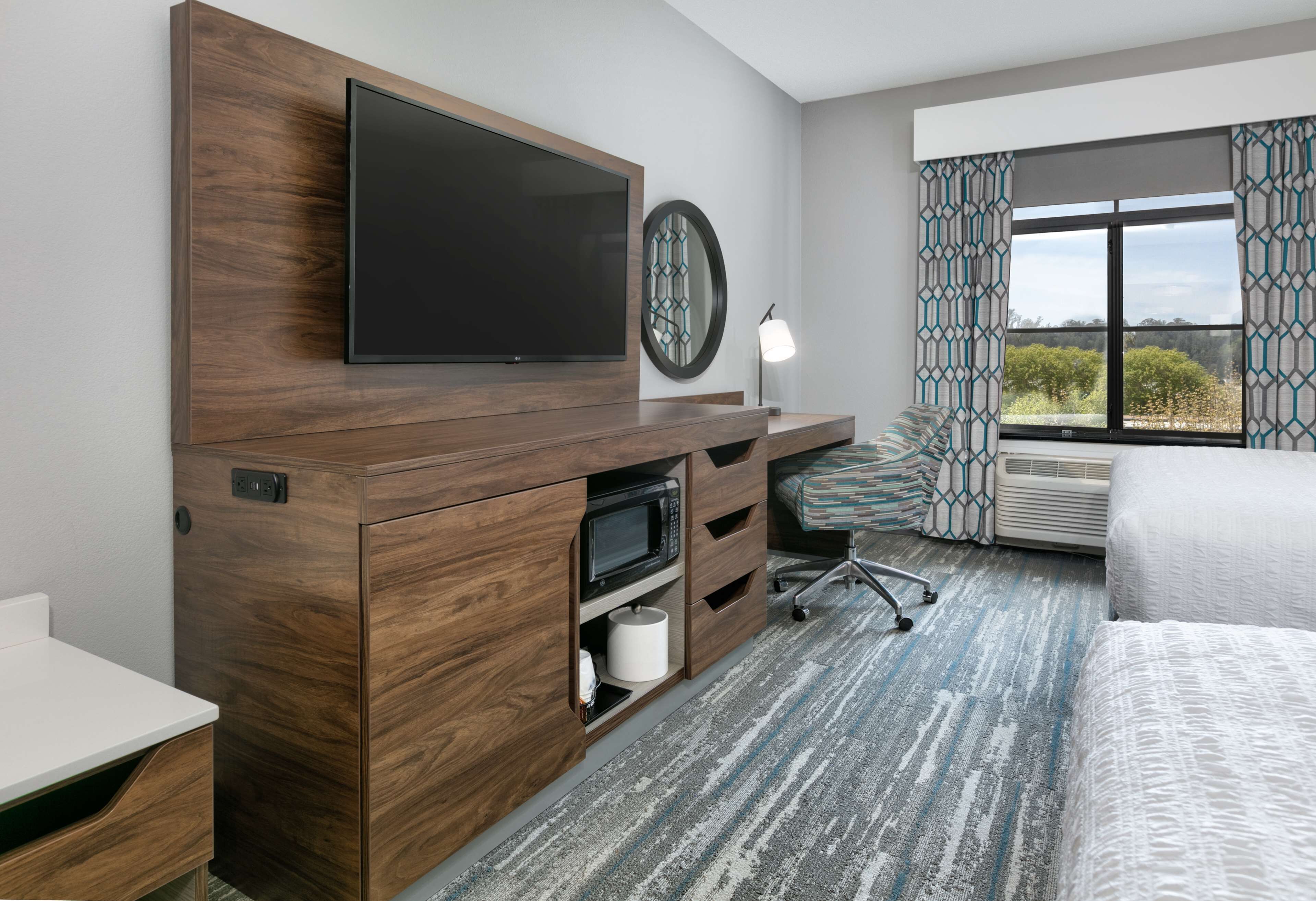 hypo-allergenic bedding, desk, laptop workspace, blackout curtains