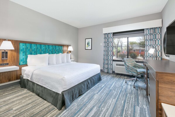 Hypo-allergenic bedding, desk, laptop workspace, blackout curtains