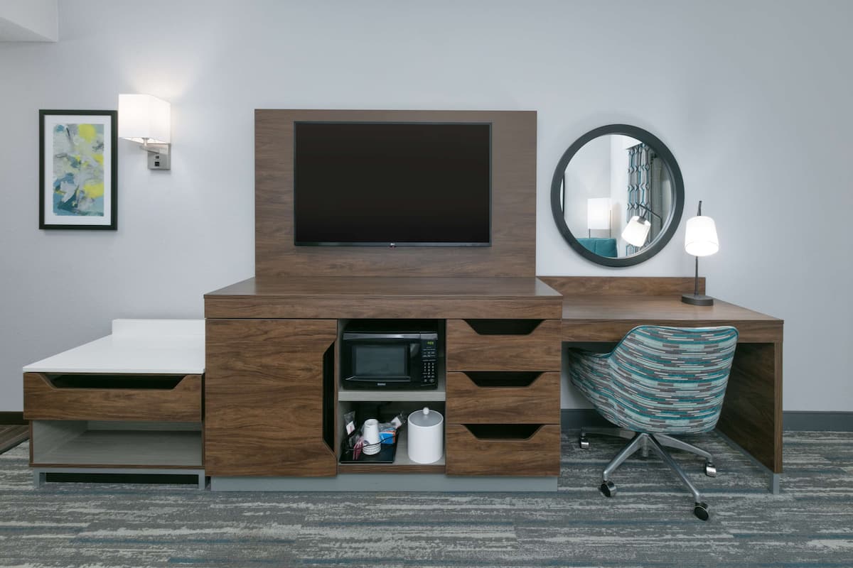 hypo-allergenic bedding, desk, laptop workspace, blackout curtains