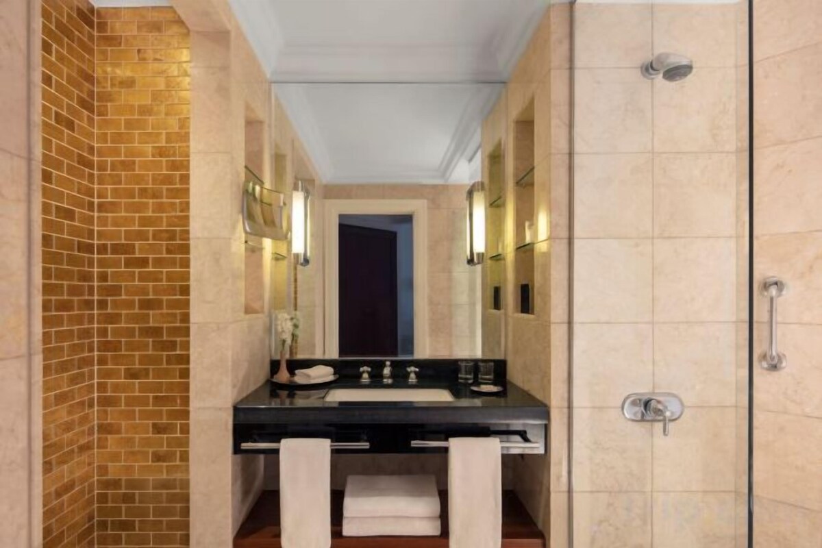 Separate tub and shower, hair dryer, bathrobes, slippers