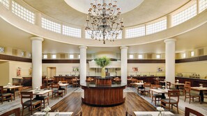 A spacious, well-lit lobby with a central reception desk, multiple seating areas, and a large chandelier. - InterContinental AMMAN JORDAN by IHG (Amman)