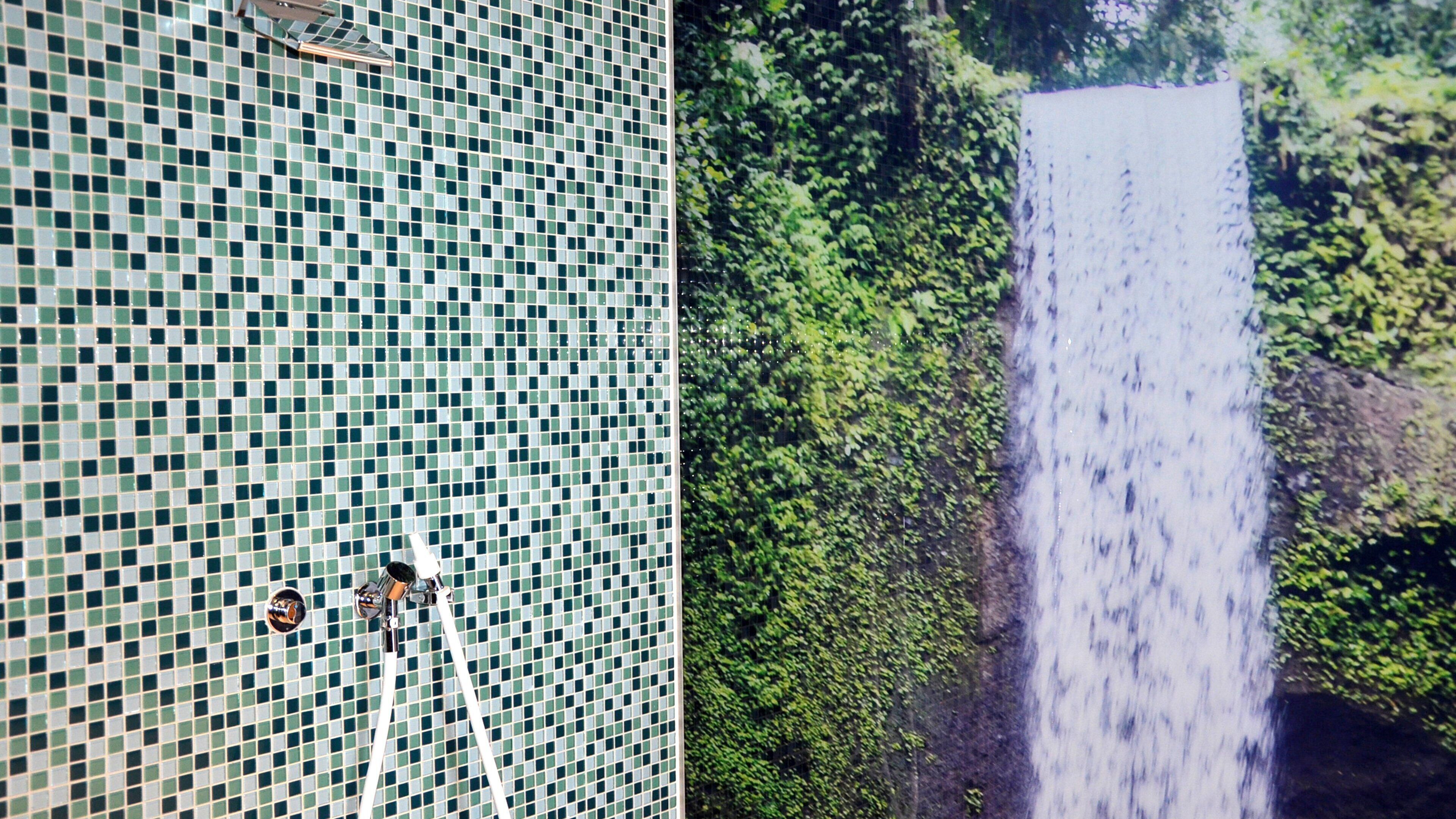 A mosaic wall and a waterfall.