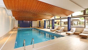 Indoor pool, pool umbrellas, pool loungers