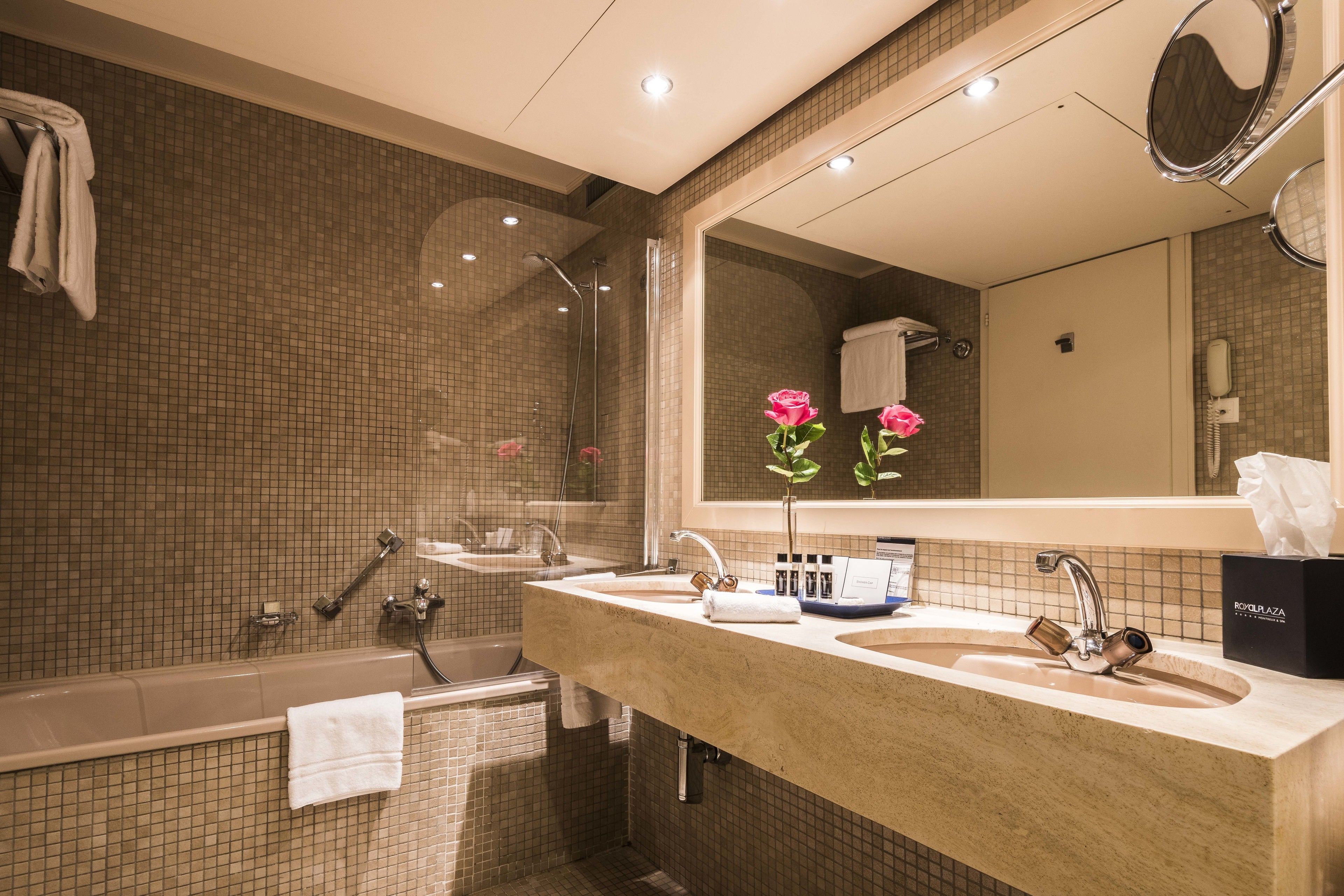 junior suite, balcony, lake view | bathroom | eco-friendly toiletries, hair dryer, bathrobes, slippers