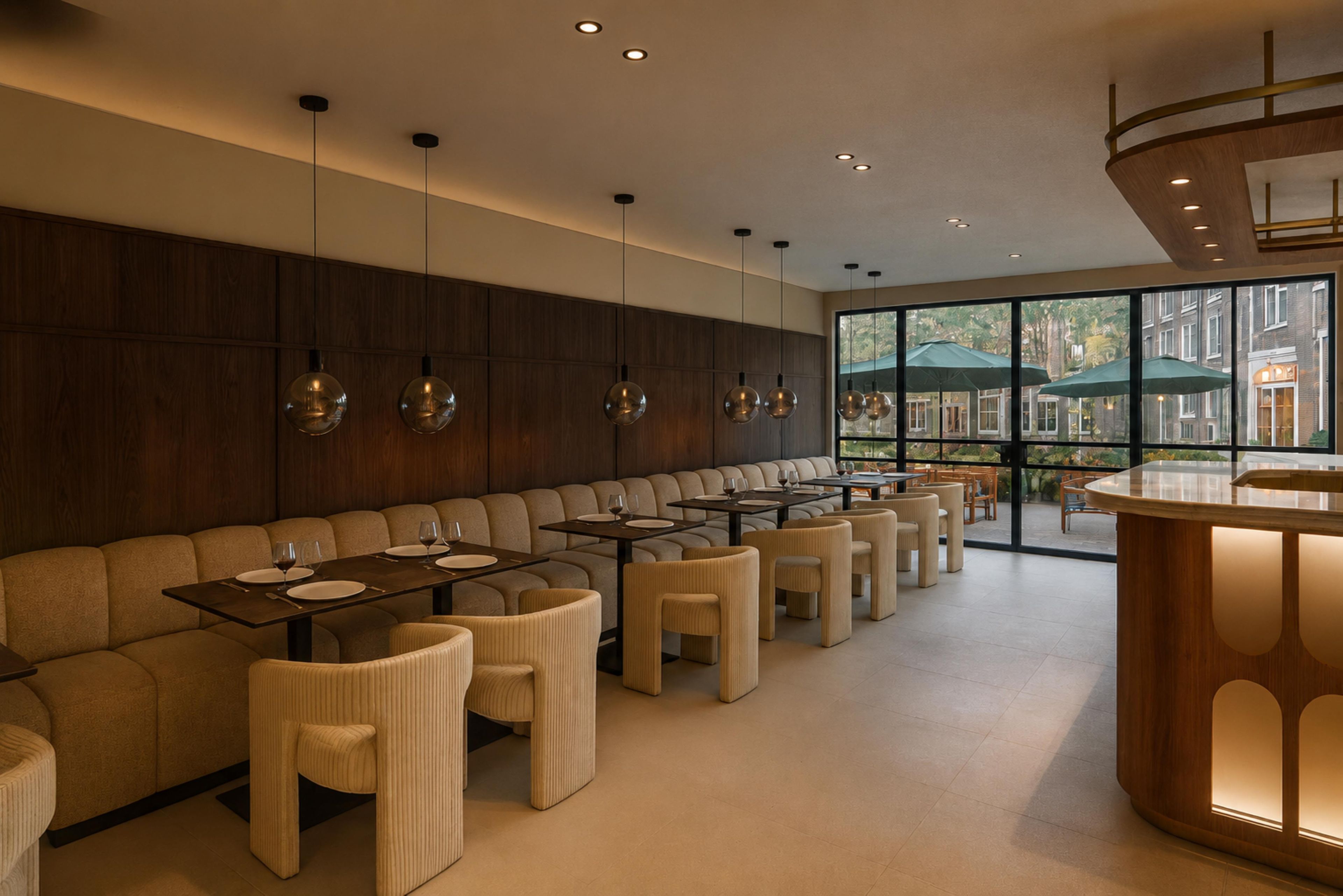 A modern restaurant with a long counter and multiple seating areas.