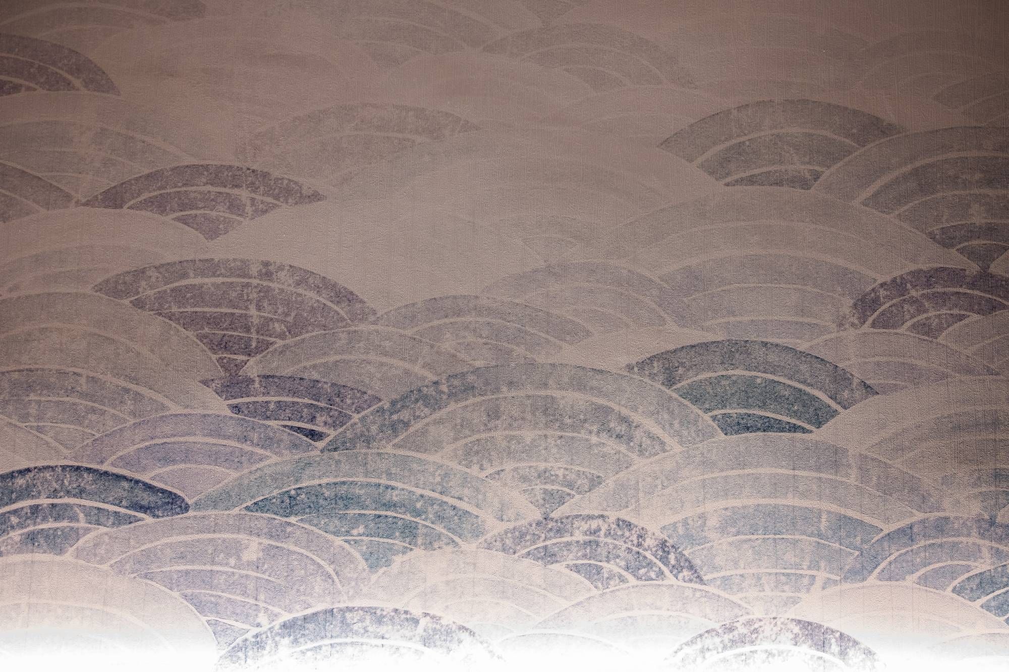 A wall with a wave pattern design.