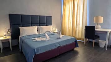 Classic Quadruple Room, 1 Bedroom, Ensuite | Minibar, in-room safe, desk, laptop workspace