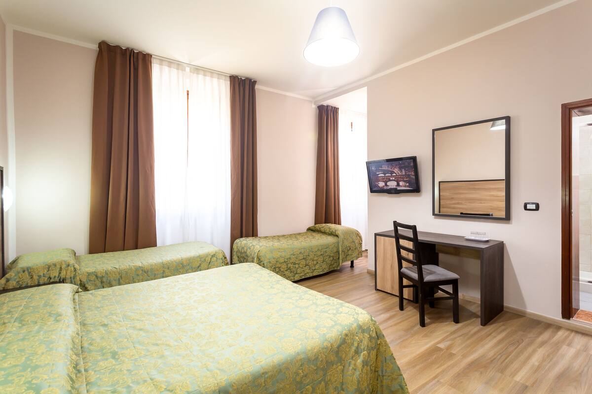 Family Room | Minibar, in-room safe, soundproofing, iron/ironing board (on request)