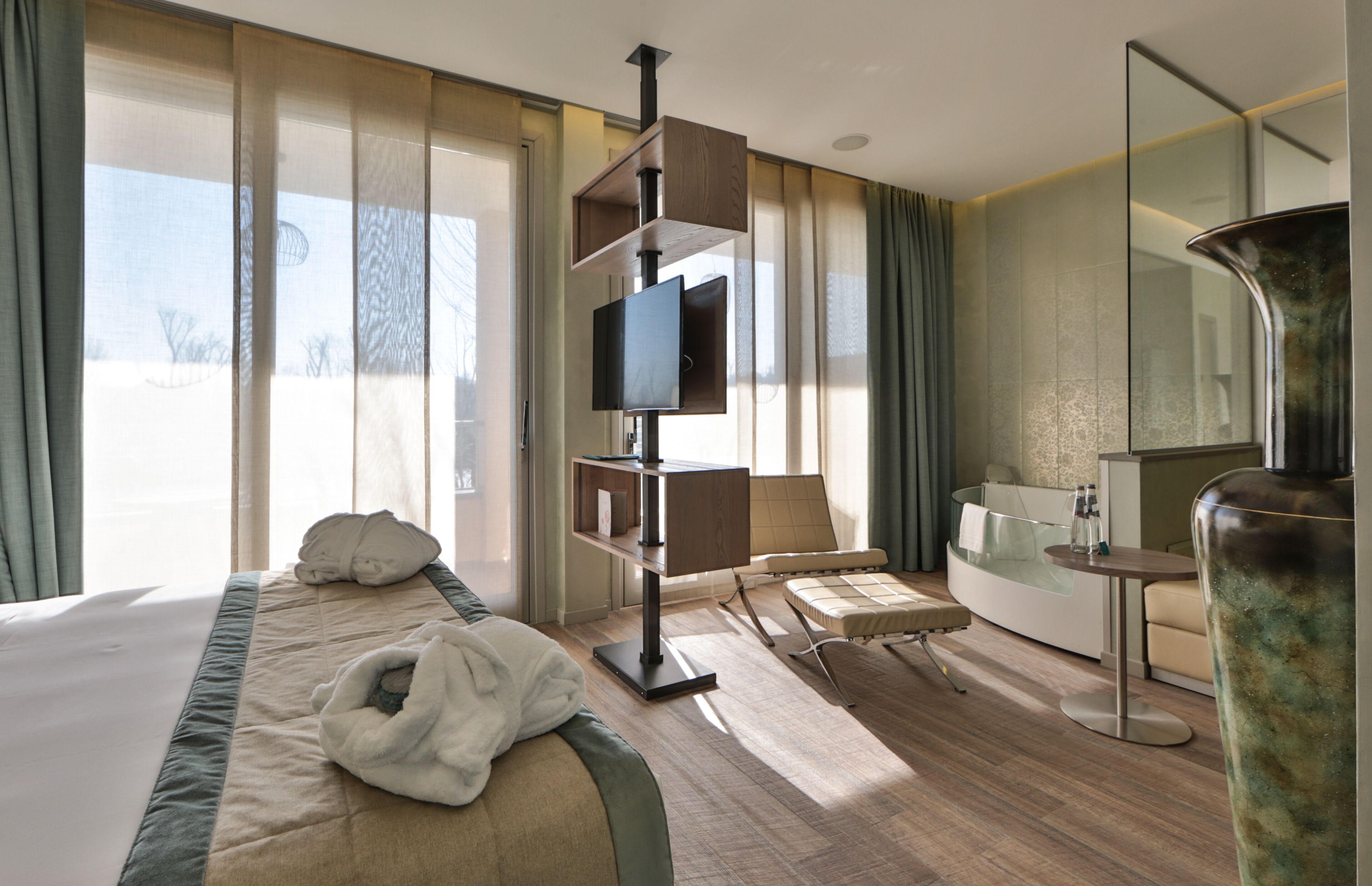 junior room, hot tub, river view (private wellness resort) | 1 bedroom, down duvets, minibar, in-room safe