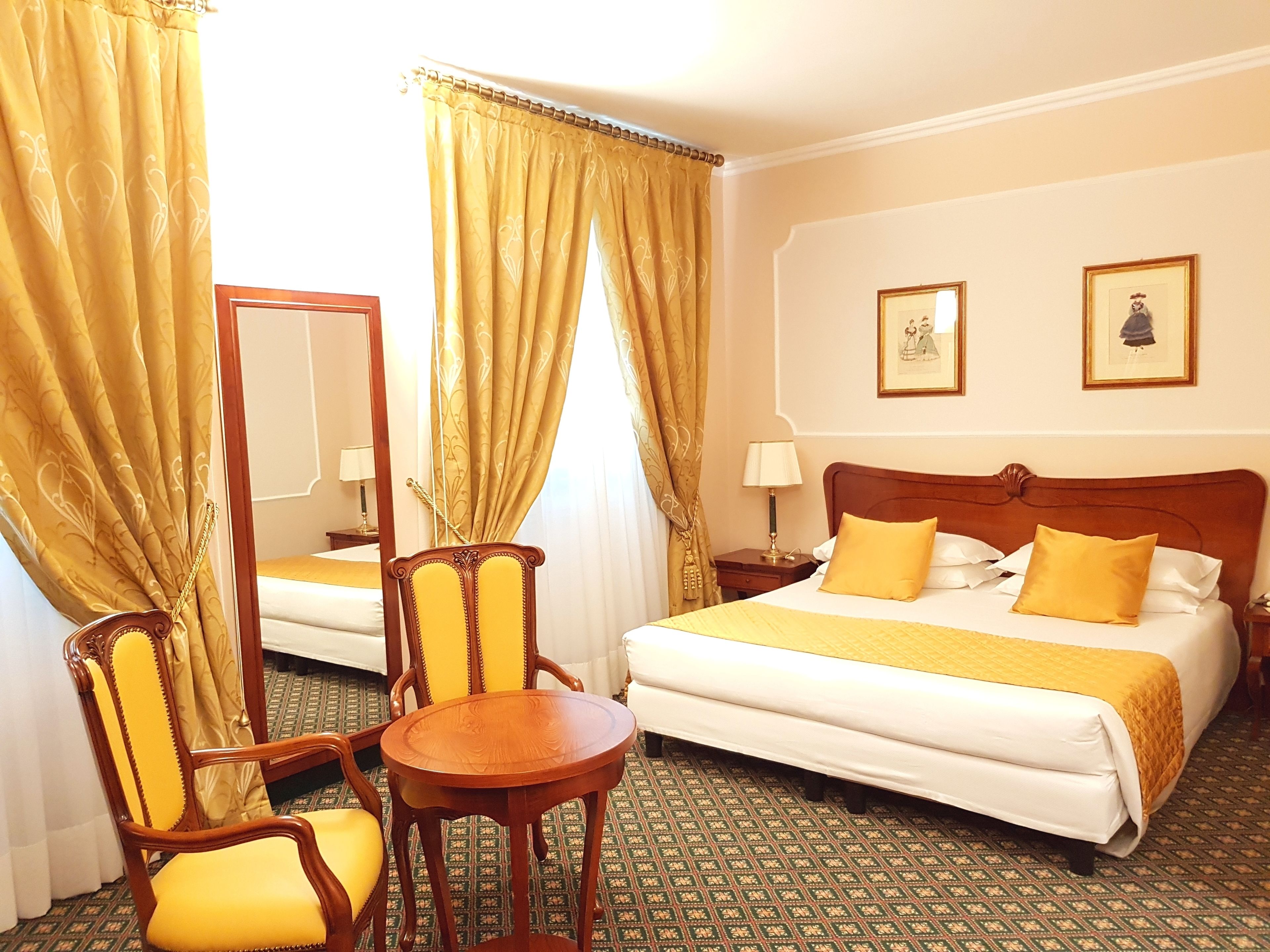 deluxe room, river view | minibar, in-room safe, desk, soundproofing