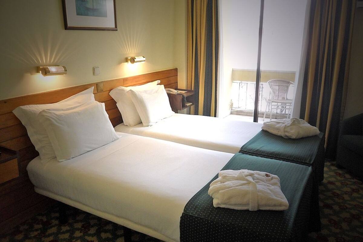 Twin Room | Minibar, in-room safe, desk, cribs (free)