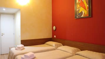 A hotel room with two beds, a red wall, a white door, and a poster on the wall.