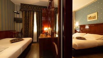 Family Triple Room | Down duvets, minibar, in-room safe, desk