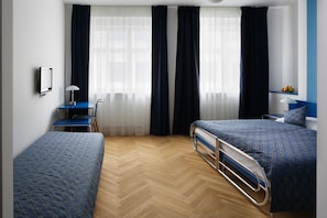 Triple Room | Desk, blackout drapes, free cribs/infant beds, free WiFi
