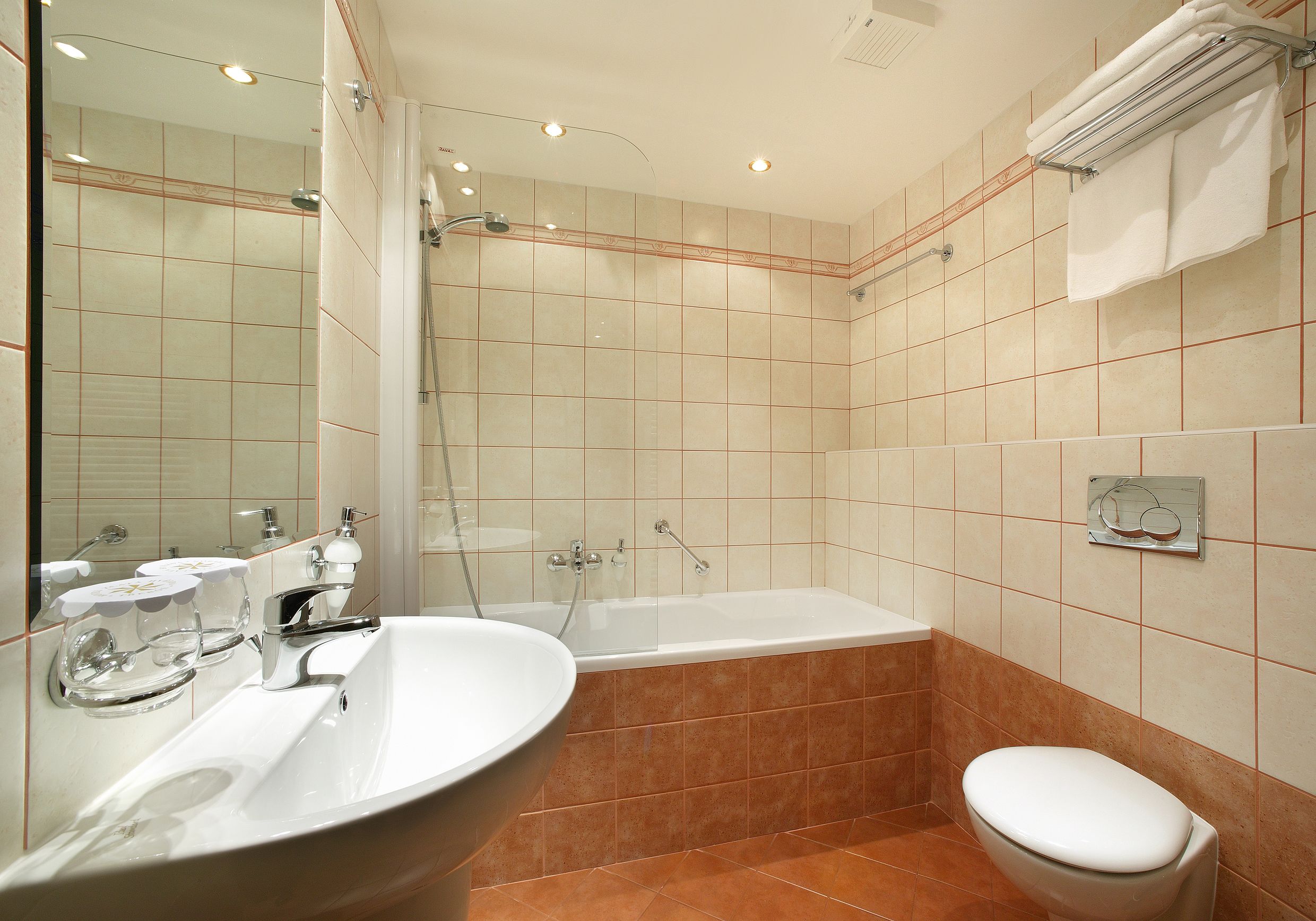A bathroom with a freestanding bathtub, a sink, and a toilet.