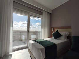 Family Room | Premium bedding, down comforters, minibar, in-room safe