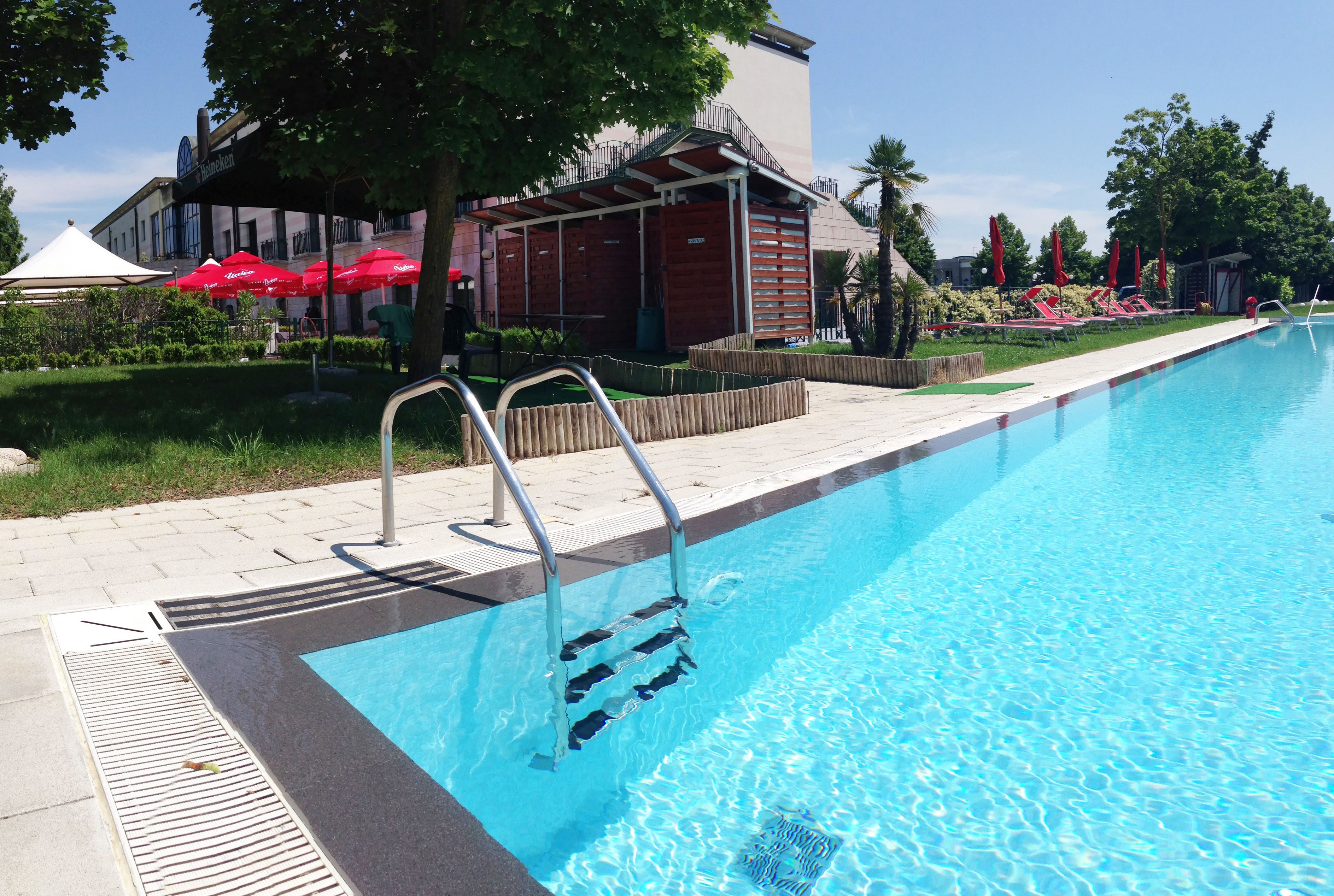outdoor pool, pool umbrellas, pool loungers