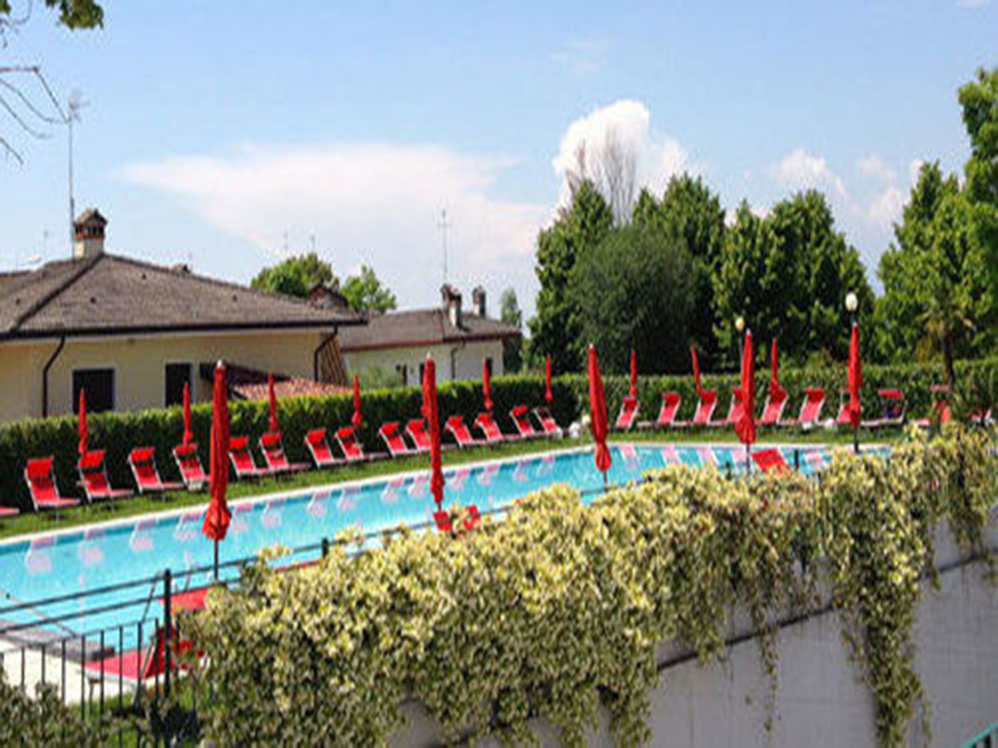 outdoor pool, pool umbrellas, pool loungers