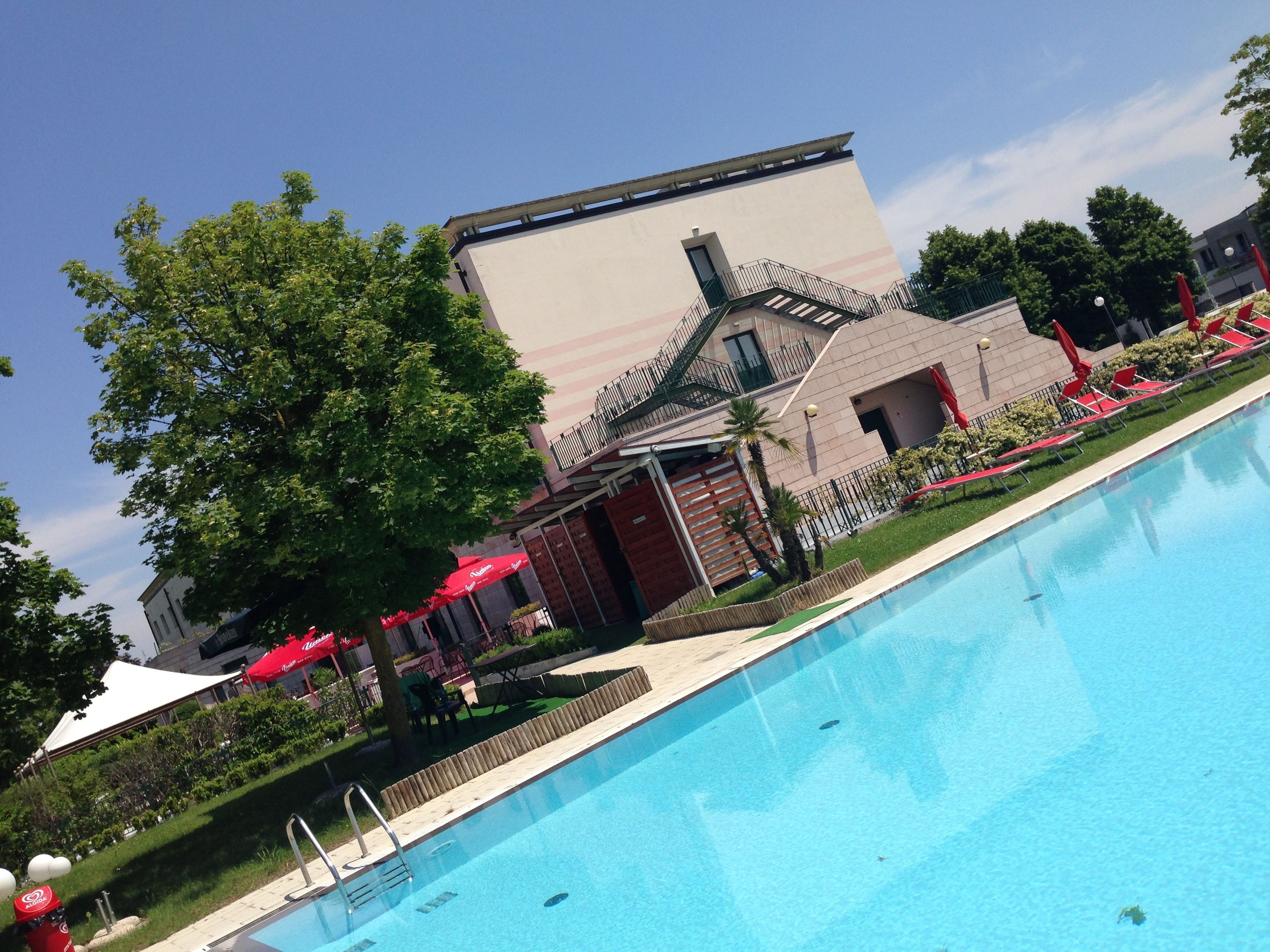 outdoor pool, pool umbrellas, pool loungers