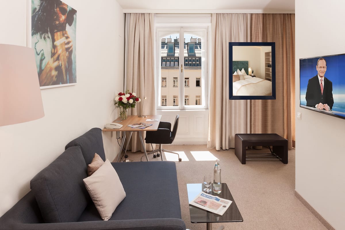 Prestige Suite | Living area | 30-inch flat-screen TV with satellite channels, TV
