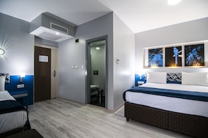 Central Triple Room - Ideal for 3 Guests | Literie de qualité, minibar, coffre-fort pour ordinateur portable