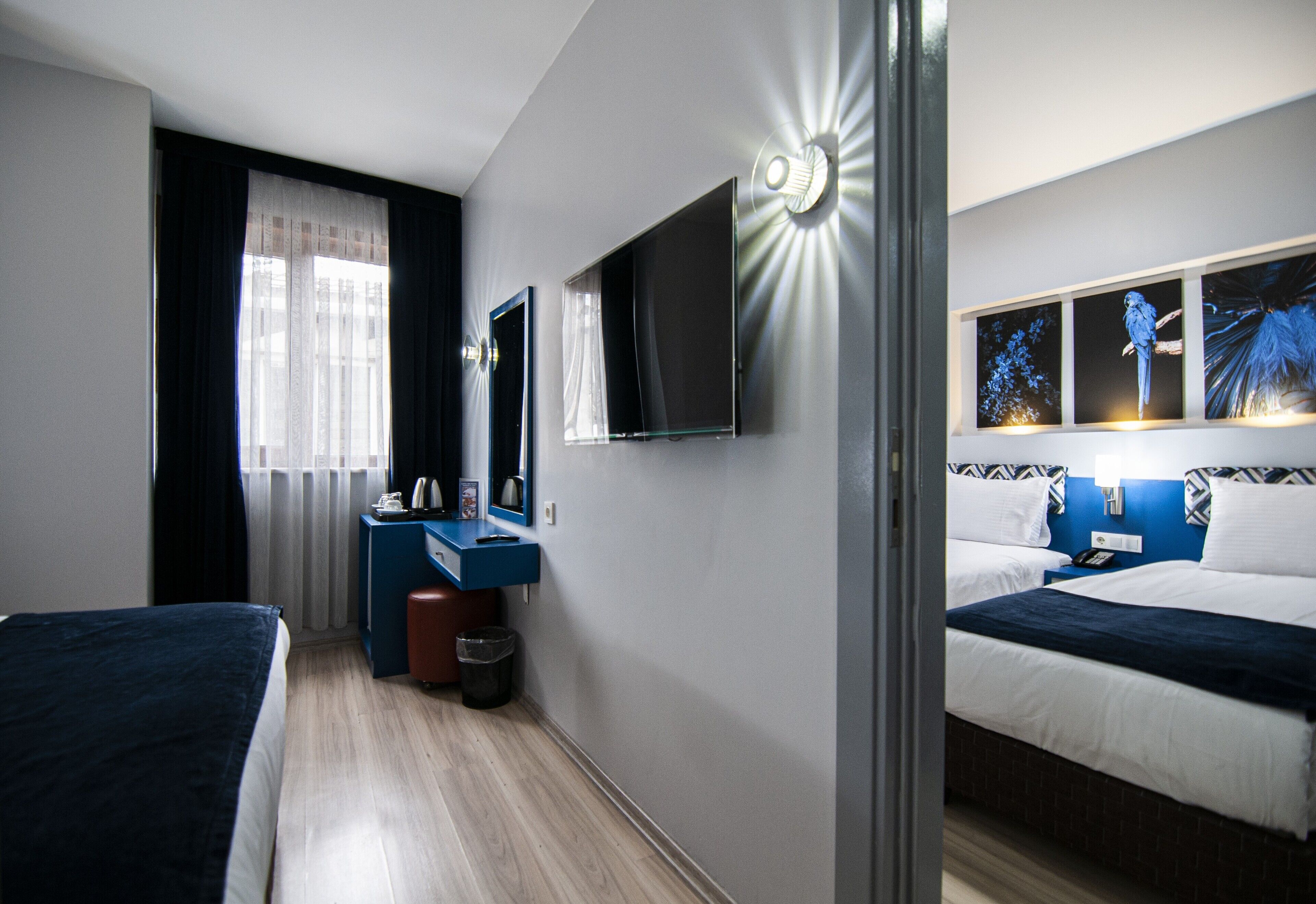 family room | premium bedding, minibar, in-room safe, desk