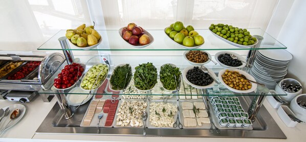 A buffet with various food items including fruits, vegetables, and cheeses. - Lapis Inn Hotel & Spa (Istanbul)