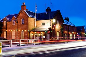 A brick building with a sign reading "BUCCLEUCH ARMS HOTEL". - Buccleuch Arms (Melrose)