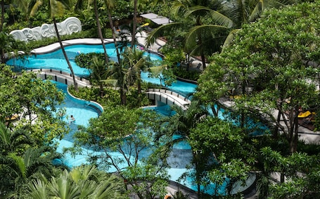 Outdoor pool, open 6:00 AM to 9:00 PM, pool umbrellas, pool loungers. Chatrium Sathon Bangkok